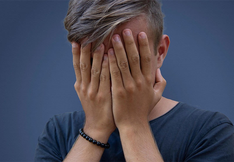 Social and Emotional Impact of Dyslexia - Boy with hands over face